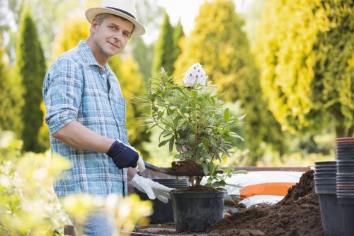 Gardening professionals working on plant selection and garden design in Brimsdown